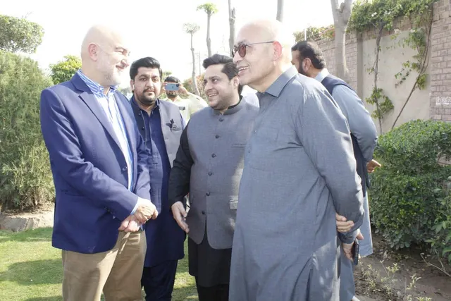 Taimoor Bamazai with the Ambassador of Spain and hosts in a garden